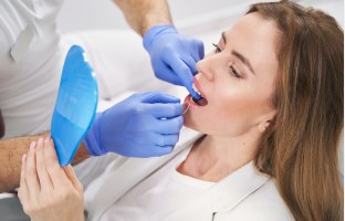 Dentist performing a preventive dental exam
